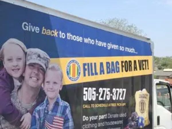 A truck with a veterans donation campaign advertisement.