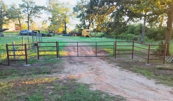 This is a 4 run pipe funnel entrance with a factory made gate. 