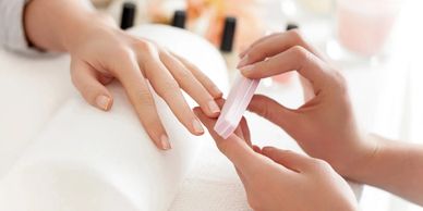 Lady getting her nails done with a manicure