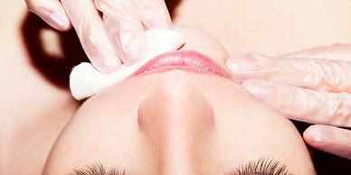 Lady getting a chin wax treatment at The One Beauty & Spa Yarralumla Canberra