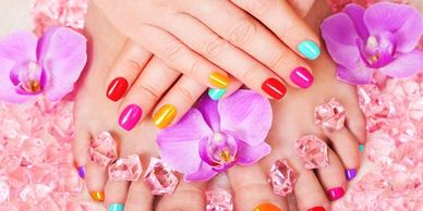 Lady's hands and feet with freshly painted nail polish