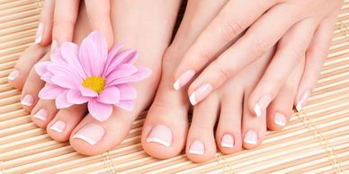 Lady's hands and feet after having nail polish removed