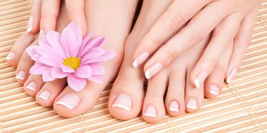 Lady's hands and feet after receiving a manicure and pedicure