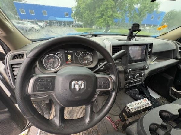 Interior view of a RAM truck's dashboard and steering wheel.