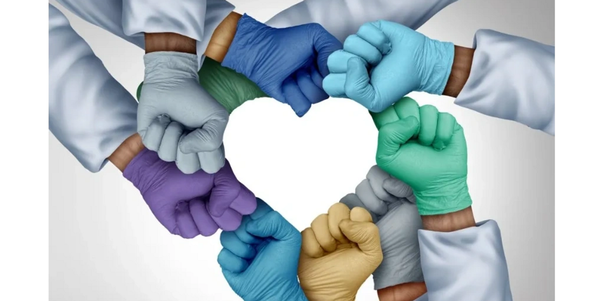 teams of healthcare workers forming heart with hands