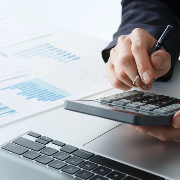 Person reviewing HR consulting rates and calculating project-based fees in British Columbia.