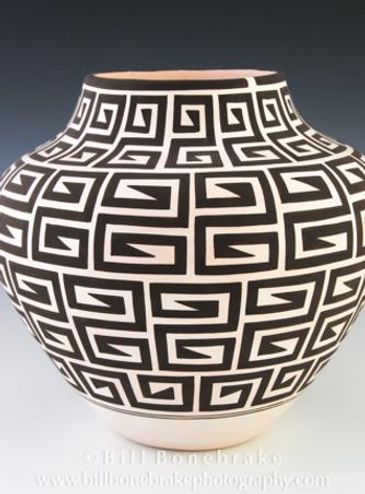 Black and white pottery vase with geometric patterns.
