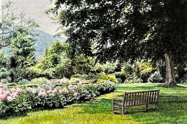 Wooden bench in a lush garden with colorful flowers.