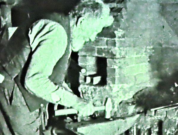 William Watkins working at the anvil