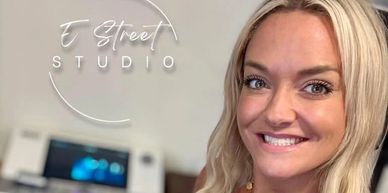 Smiling woman in a studio setting.