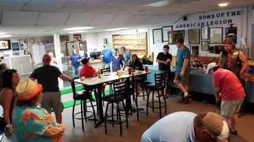 A lively group gathers inside the Sons of the American Legion hall.