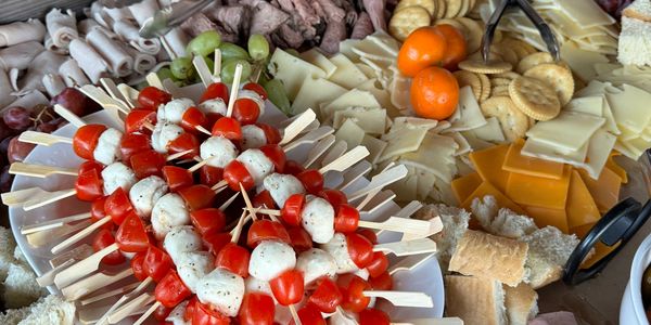 Farm-to-table charcuterie with Caprese skewers and assorted meats – Century Farm Catering
