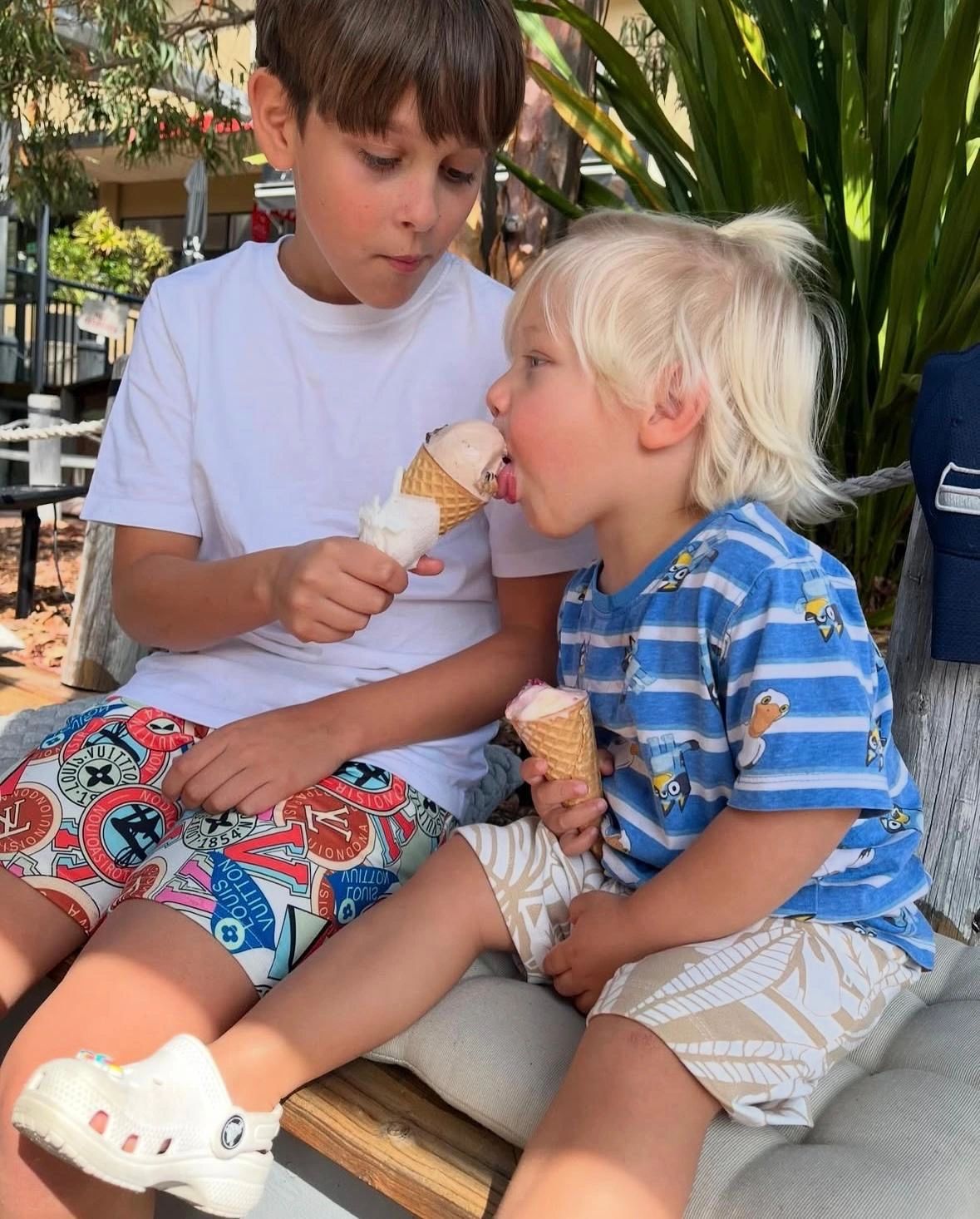 Two children eating gelato