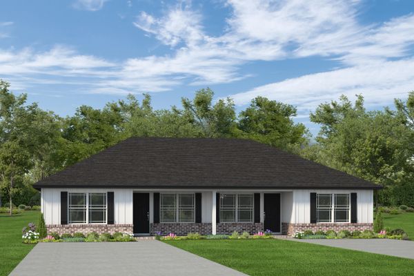 Modern duplex with a black roof and white siding under a blue sky.