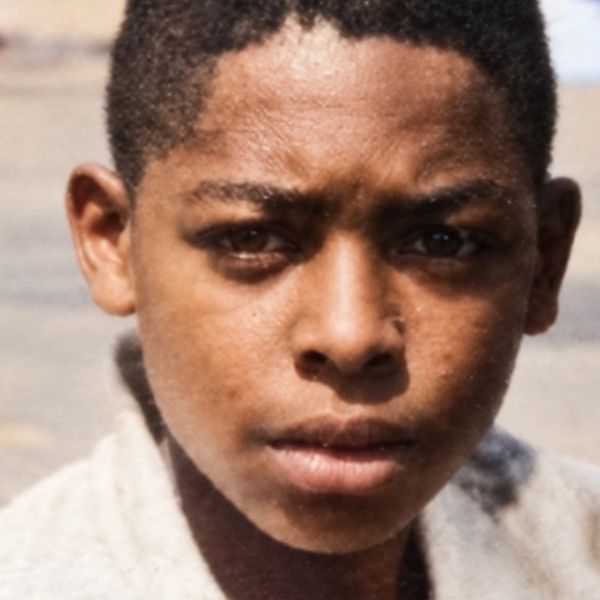 Close-up of a boy with a serious expression.