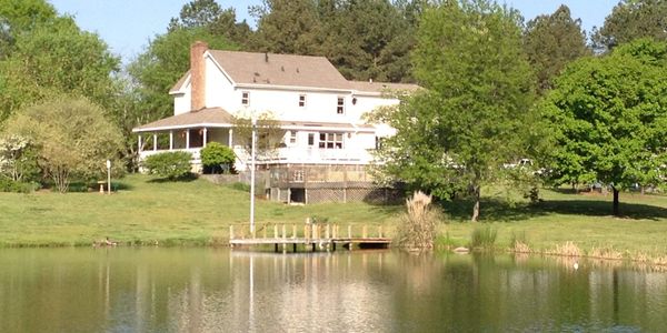 The pond side of Seven Springs Venue
Nature at its finest with plenty of green trees and grass. The 