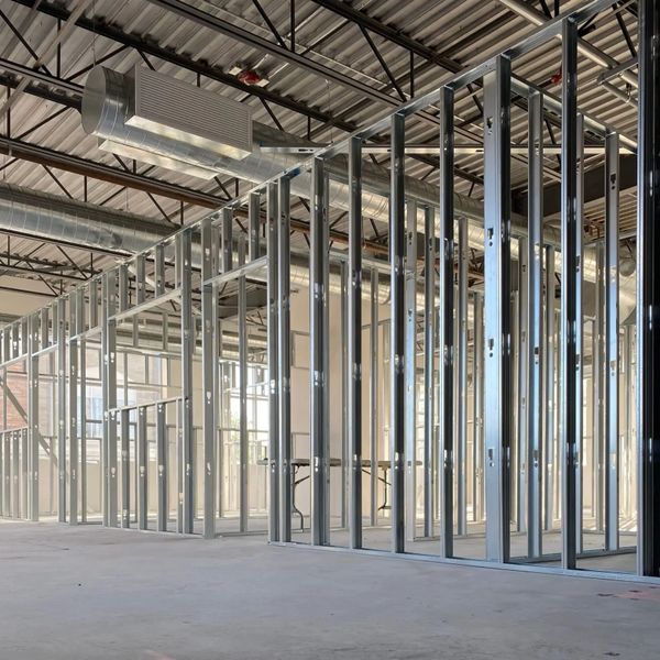 Metal framing structures inside a building under construction.