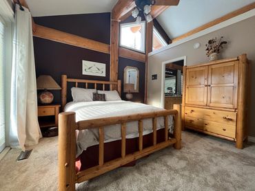 Authentic log furniture in master suite.