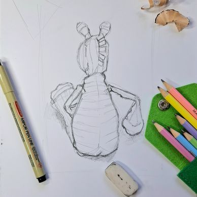 Sketch of a character with colored pencils and eraser on paper.