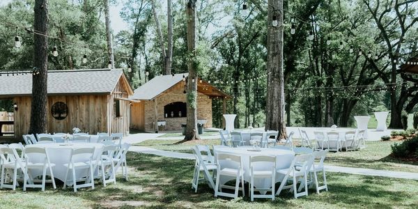  Outdoor wedding reception space with string lights at Oak Hill Farm in Kentwood Louisiana