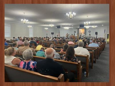 Congregation seated inside a church during a service or event.