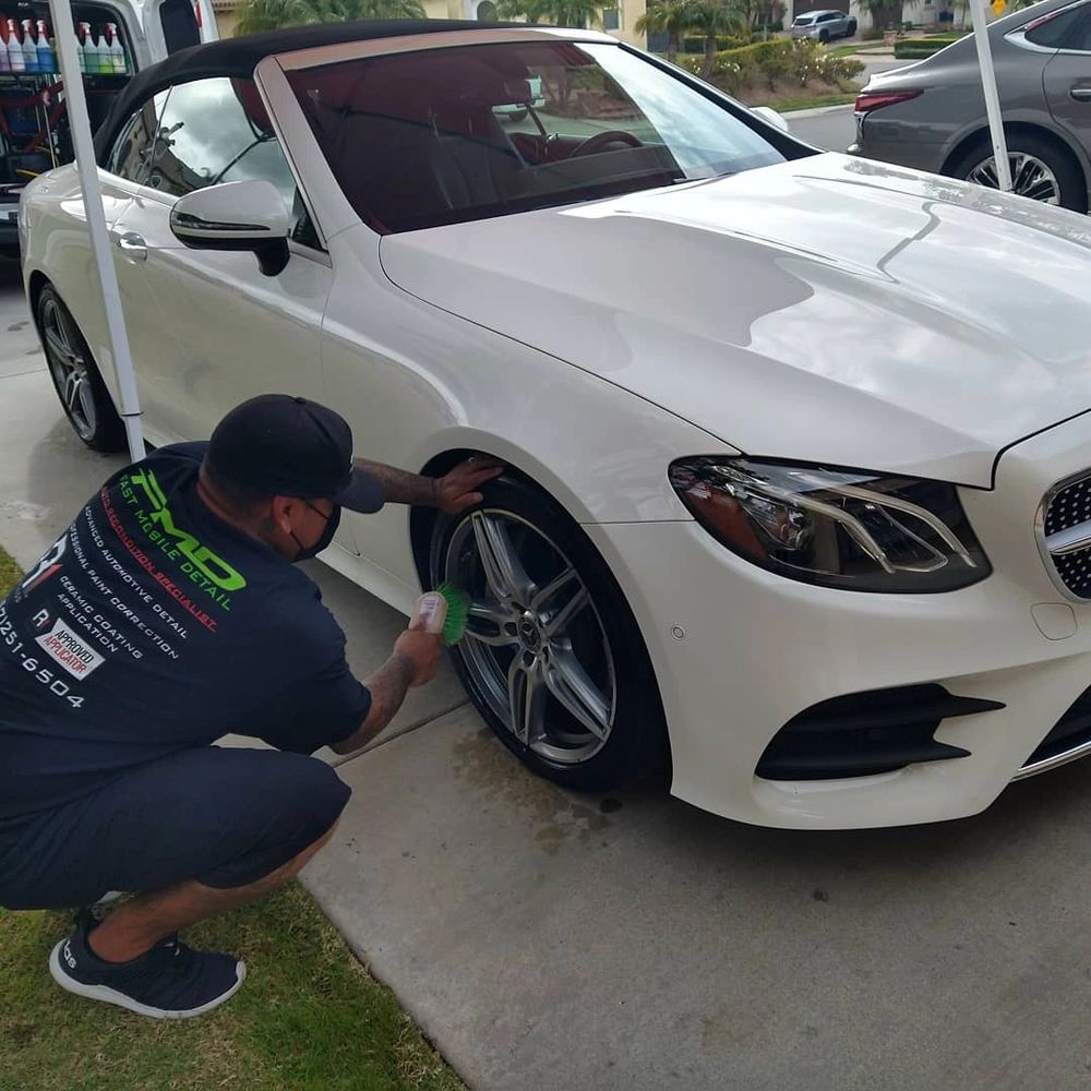 Guy cleaning tires