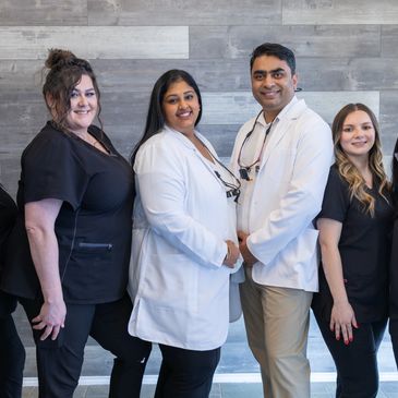 Dr. Gundarpi and Dr. Ummareddy with staff from Arlington Dental Clinic