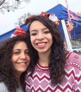 Marian and Sonia taking a quick selfie after setting up our booth