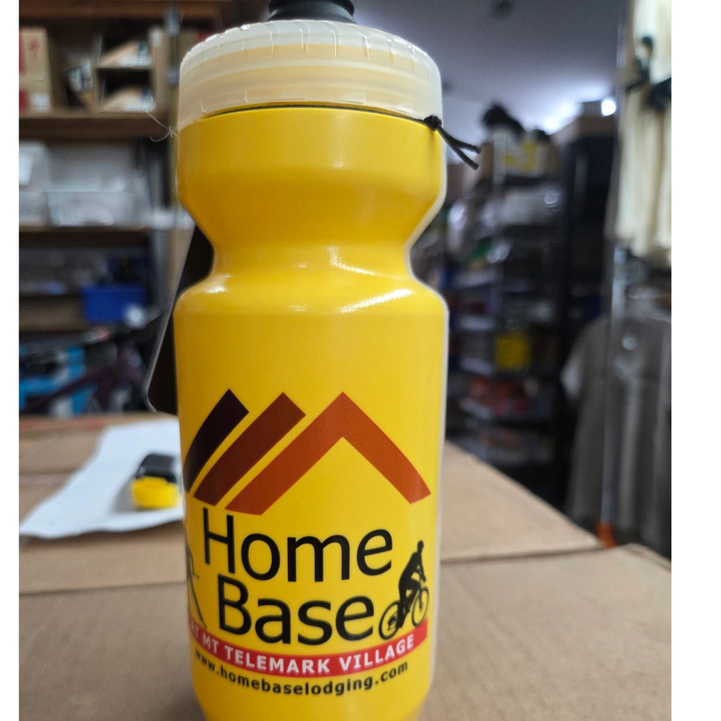 Photo of a Yellow Water Bottle with the Home Base logo