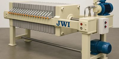 Industrial filter press machine with multiple plates and motors.