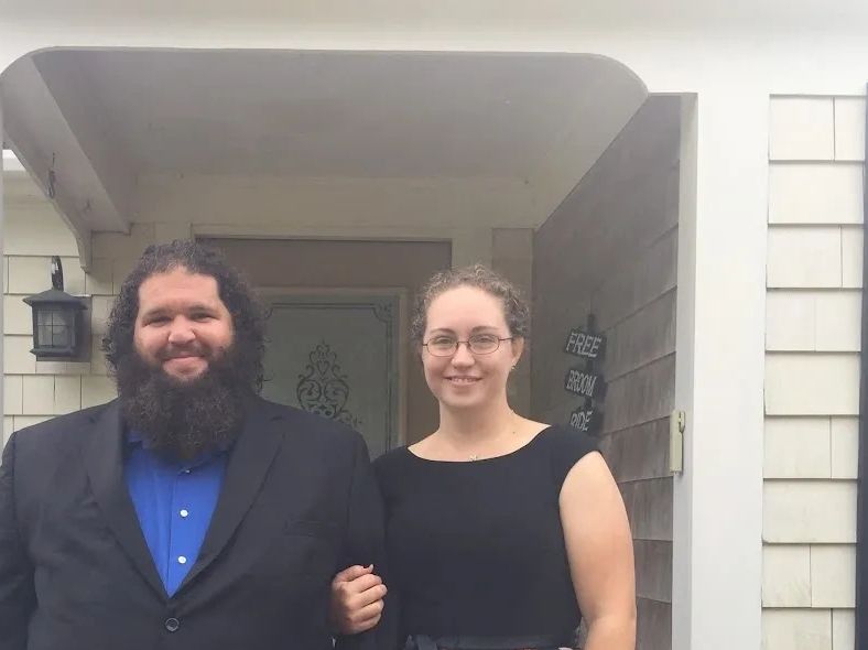Photo of Farmer and his wife in formal clothing, ready to attend a friend's event.