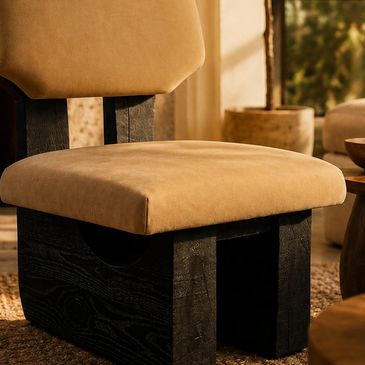 Beige cushioned chair with a black wooden base.