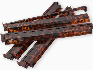 Elevate your game night experience with our chic Tortoise Shell Rack and Pusher Set! Crafted for dur