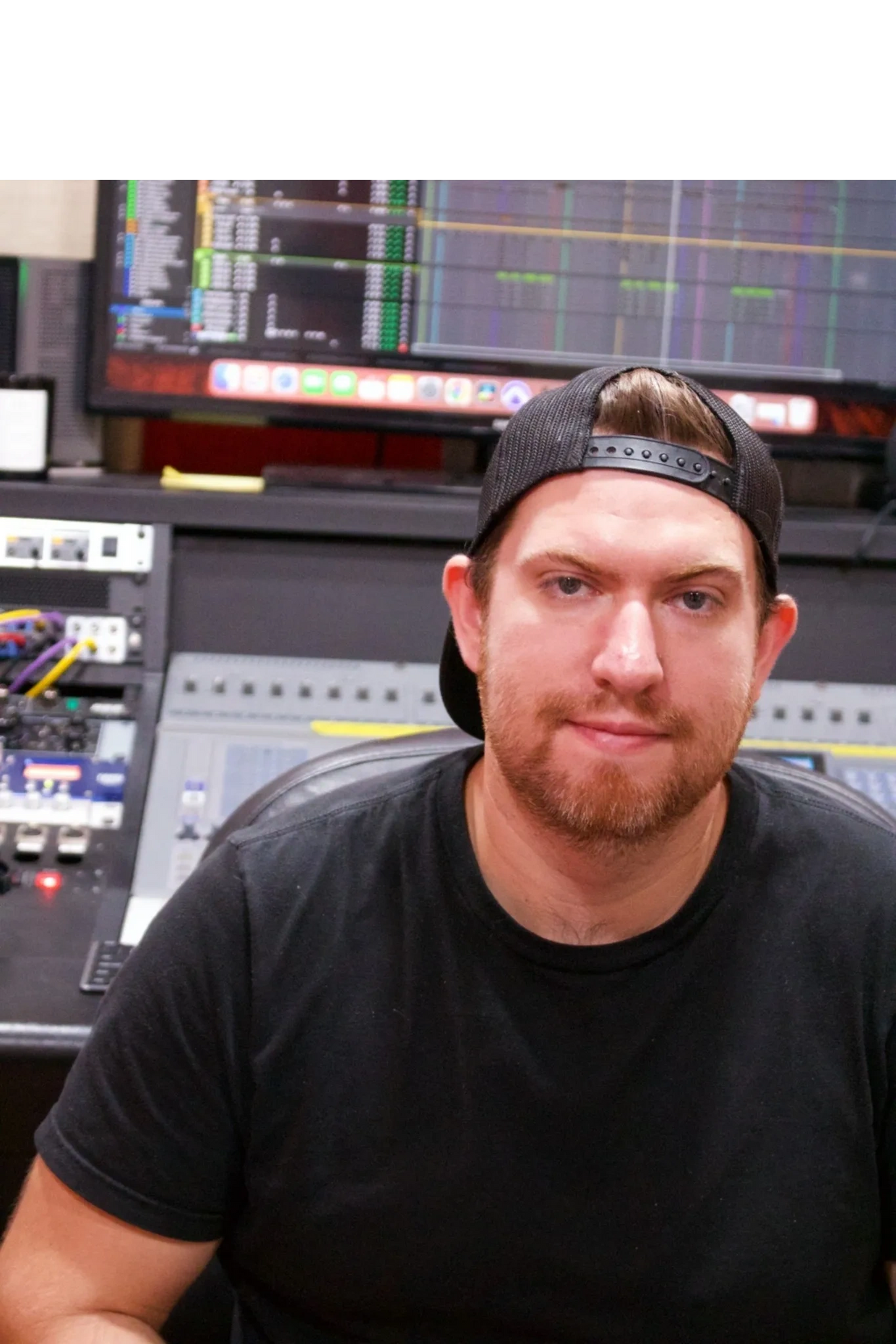 Brian Martinez Music Producer in front of his mixing console