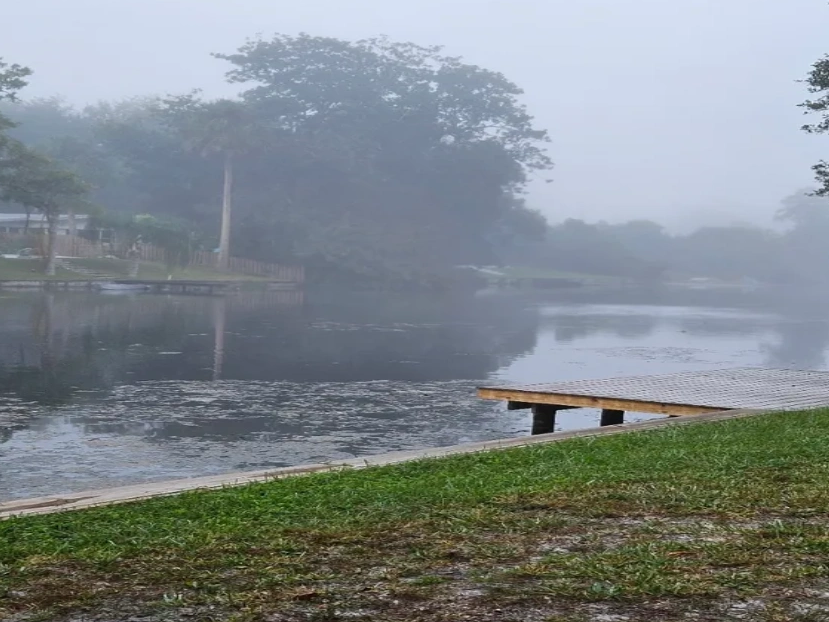 Foggy view of dock and lake