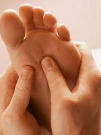 foot being massaged, reflexology