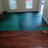 category 2 water damage stain on subfloor under hardwood floor 