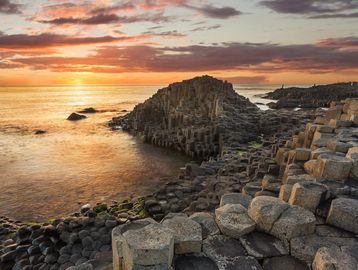 Sunset over the hexagonal basalt columns at Giant's Causeway.