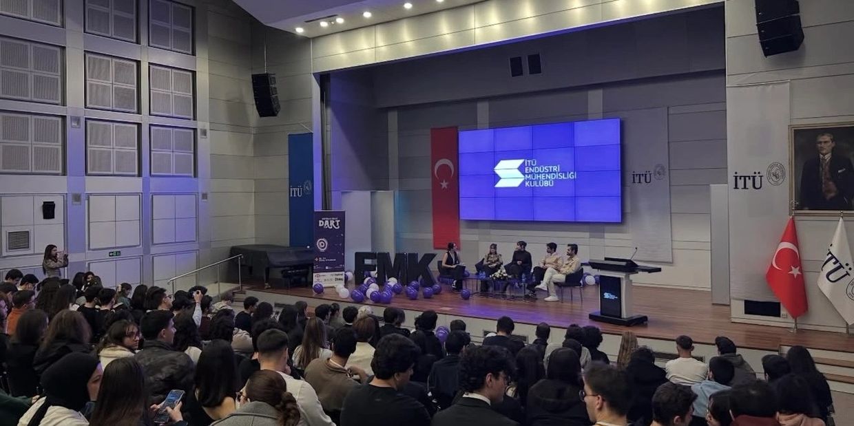 Panel discussion at ITU Industrial Engineering Club with a large audience.