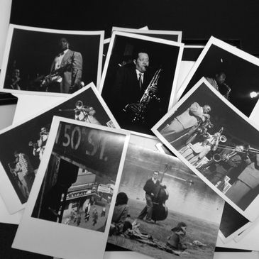 Pile of photographs featuring jazz musicians. Charlie Parker, Lester Young, and others.