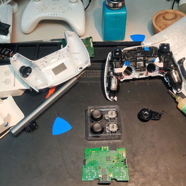 A photo of a DualSense controller getting a TMR upgrade at Sagebrush Repair.