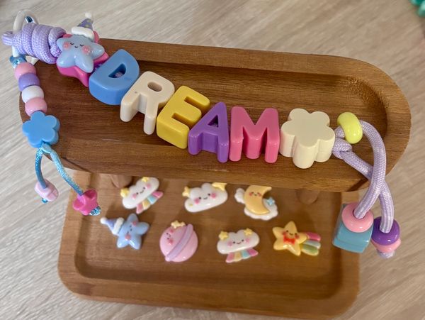 Colorful beaded keychain with the word DREAM.
