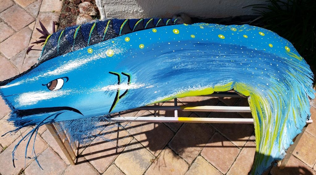 blue fish handpainted on palm frond in Melbourne Beach Florida