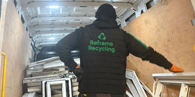 Reframe Recycling van loaded with uPVC window frames from installation jobs in Manchester