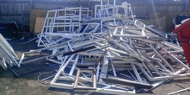 Windows ready for recycling collection at a trade site in the North West. 