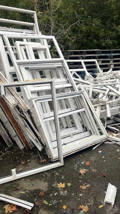 Post consumer window frames stacked for collection in Bury ready for recycling
