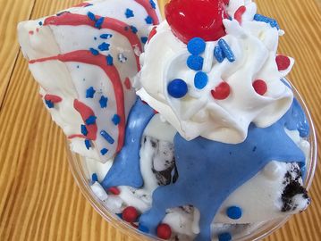Patriotic ice cream with red, white, and blue toppings.