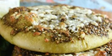 Homemade Flat soft Pita topped with Feta cheese, Israeli Za'atar and delicious Olive Oil. 