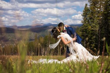 Wedding Couple Kiss at Ten Mile Station in Breckenridge, Colorado.