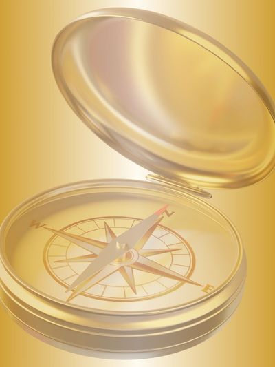 Golden compass with lid open.